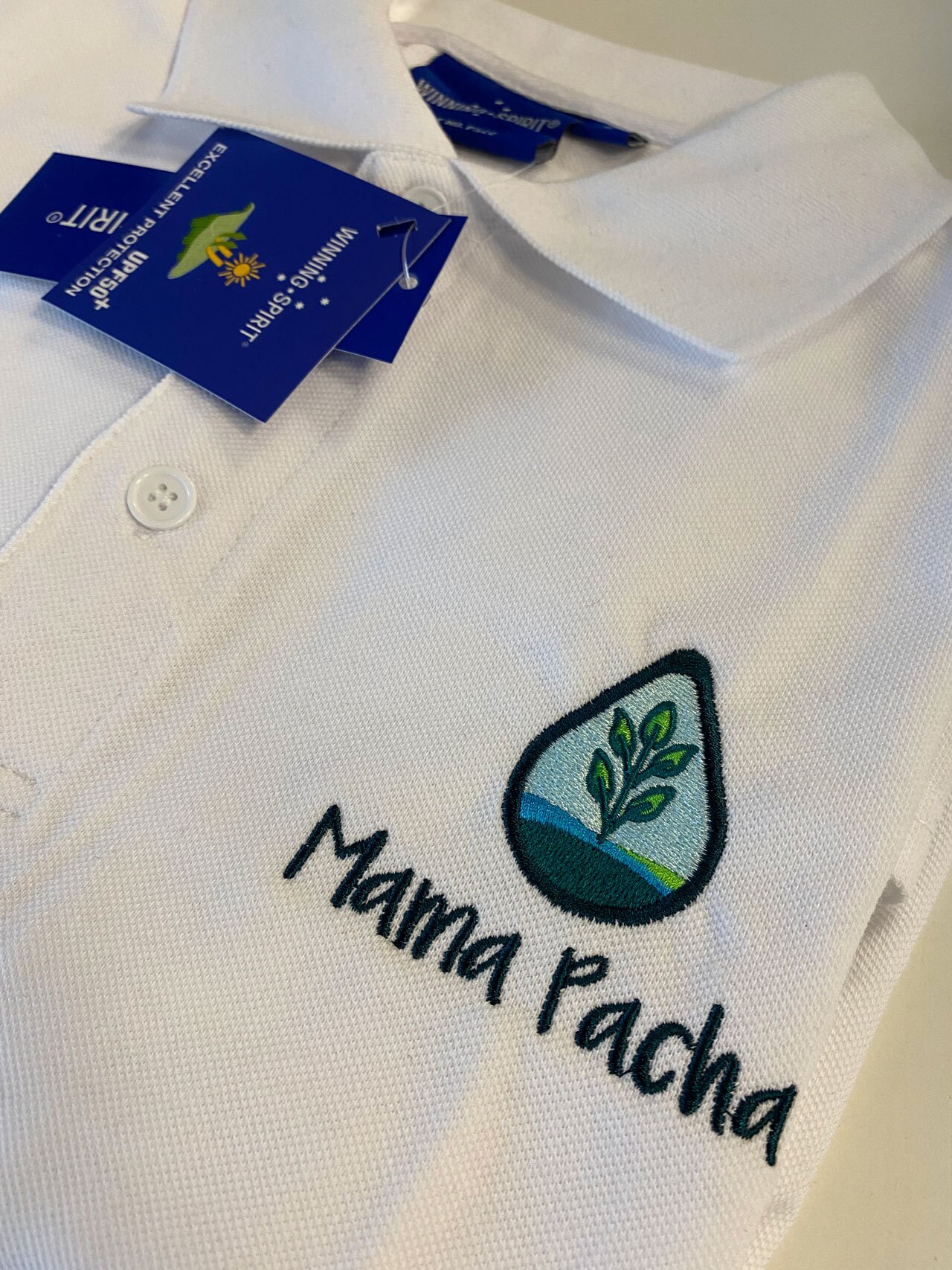 Mama Pacha branding on polo shirt